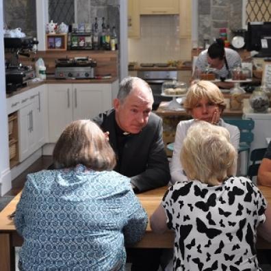 Bishop Robert meeting people at Trading Routes cafe, Plymouth