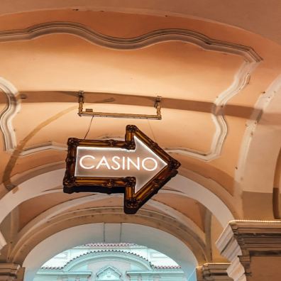 A casino sign hanging from the ceiling.