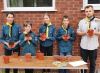 Scout troop potting up sunflower seeds