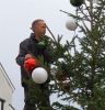 Kevin Palfrey from Otter Garden Centres adding the top decorations