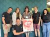 Westbank's Katie Elliott, centre, with the supportive team at Nettl