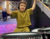Little boy playing the drums in music studio