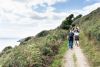 Group of students walking a Devon coastal path