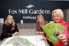 Jill Moores, Bellway Sales Advisor, with Sharon Trerise, General Manager at Unite Carers, and Bernice Philbrick, Chair of Trustees at Unite Carers inside the sales office at Bellway’s Fox Mill Gardens development in Willand.