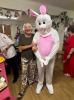 L-R Community visitor Pam Martin with the White  Rabbit, aka Adam Stratton, healthcare assistant