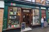 Bookshop with books in the window and two women standing outside