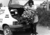 Marilyn White with hanging basket in the early days of Otter Garden Centres
