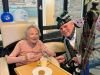 Butterfly Lodge resident Audrey with Dave The Lone Piper