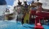 Boy and father at pirate waterpark play structure, Splashdown Quaywest