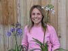 A woman holding varieties of Agapanthus