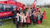 photo of Devon Air Ambulance with people standing next to it