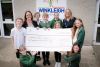 Michele Jones, Allison Homes Sales and Marketing Manager, presents a cheque for £250 to Executive Headteacher, Mrs Victoria Fenemore and Year 6 pupils at Winkleigh Primary School.