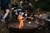 Children roasting marshmallows on a camp fire